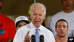 FILE - Former Vice President Joe Biden speaks at a rally in support of Conor Lamb, the Democratic candidate for the March 13 special election in Pennsylvania's 18th Congressional District in Collier, Pa., March 6, 2018. 