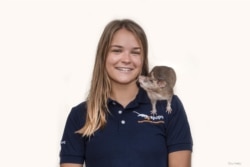American researcher Ellie Cutright with an African giant pounched rat. She trains them to find underground explosives.
