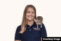 American researcher Ellie Cutright with an African giant pounched rat.