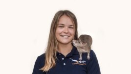 American researcher Ellie Cutright with an African giant pounched rat. She trains them to find underground explosives.