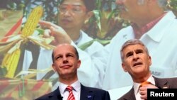 FILE - Juergen Hambrecht (R), CEO of German chemical company BASF, poses with CFO Kurt Bock during the annual news conference in Ludwigshafen, Germany.