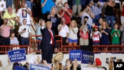 President Donald Trump waves as he leaves a rally in Harrisburg, Pa., April 29, 2017.