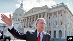 FILE - Republican Senate Majority Leader Mitch McConnell, stands outside of the U.S. Capitol in Washington, July 23, 2013. Analysts say Democrats could reclaim control of the Senate, but face an uphill fight in the House Representatives.