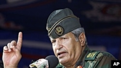 Libyan rebel forces chief commander Abdel Fattah Younes speaks during a rally in the rebel-held city of Benghazi, July 6, 2011