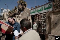 A truck loaded with goods arrives for Christian families who fled el-Arish at the Evangelical Church in Ismailia, 120 kilometers (75 miles) east of Cairo, Egypt, Feb. 26, 2017. Egyptian Christians fearing attacks by Islamic State militants are fleeing the volatile northern part of the Sinai Peninsula.