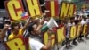 Filipinos chant anti-China slogans over the disputed Scarborough Shoal islands in the South China Sea claimed by both nations as they march toward the Chinese consulate in the Makati financial district of Manila, Philippines, May 11, 2012. 