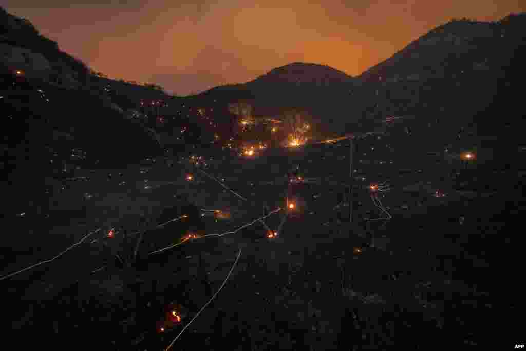 A time exposure shows embers from Saddleridge Fire blown by the wind in the Porter Ranch section of Los Angeles, California.