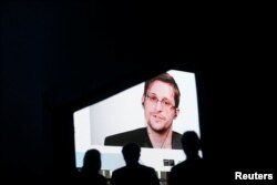Edward Snowden speaks via video link during the Estoril Conferences - Global Challenges, Local Answers in Estoril, Portugal, May 30, 2017.