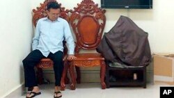 FILE - In this Feb. 1, 2018, file photo, former opposition leader Kem Sokha sits at the appeals court during the hearing of a bail application, in Phnom Penh, Cambodia.