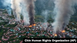 Fires burn in town of Thantlang in Myanmar's northwestern state of Chin, Oct. 29, 2021. More than 160 buildings in the town, including 3 churches, have been destroyed by fire caused by shelling by government troops.