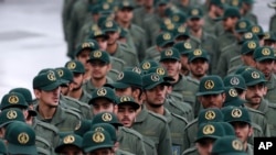 Iranian Revolutionary Guard members arrive for a ceremony celebrating the 40th anniversary of the Islamic Revolution, at the Azadi, or Freedom, Square, in Tehran, Iran, Feb. 11, 2019.