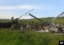 Remains of a downed Azerbaijani forces helicopter lie in a field in the separatist Nagorno-Karabakh region, April 2, 2016.