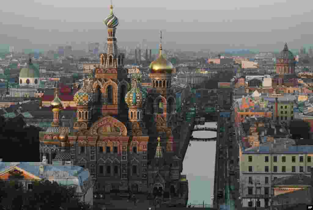 In this aerial photo taken from a remote-controlled helicopter the Savior of Spilled Blood Cathedral is bathed in light, with the Griboyedov canal at right in St. Petersburg, Russia.