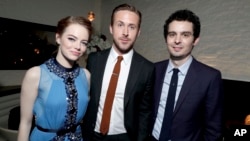 FILE - Emma Stone, Ryan Gosling and writer/director Damien Chazelle seen at the Los Angeles Premiere of "La La Land" afterparty at Village Theatre in Los Angeles, Dec. 6, 2016.