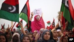 Libyan women celebrate the revolution against Moammar Gadhafi's regime and demand more rights.