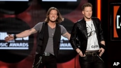 Tyler Hubbard, left, and Brian Kelley, of Florida Georgia Line, on stage at the Billboard Music Awards at the MGM Grand Garden Arena in Las Vegas, May 19, 2013. 
