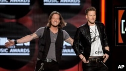 Tyler Hubbard, left, and Brian Kelley, of Florida Georgia Line, on stage at the Billboard Music Awards at the MGM Grand Garden Arena in Las Vegas, May 19, 2013.