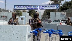 Taliban forces stand guard at the entrance gate of Hamid Karzai International Airport a day after U.S troops withdrawal in Kabul, Afghanistan August 31, 2021. 