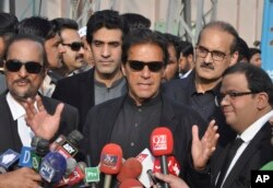 Pakistan's opposition leader, Imran Khan, center, speaks to reporters in Islamabad, Jan. 2, 2018. Khan criticized U.S. President Donald Trump on Jan. 3 as "ignorant and ungrateful" after the U.S. leader accused it of harboring terrorists.