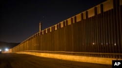 A portion of the new steel border fence stretches along the US-Mexico border in Sunland Park, New Mexico, March 30, 2017. This fencing just west of the New Mexico state line was planned and started before President Donald Trump's election.