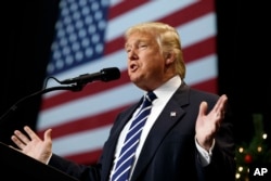 FILE - President-elect Donald Trump speaks during a rally at the Wisconsin State Fair Exposition Center in West Allis, Wisconsin, Dec. 13, 2016.