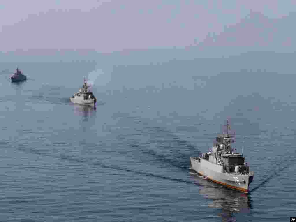 Iranian naval ships take part in a naval parade on the last day of the Velayat-90 war game in the Sea of Oman near the Strait of Hormuz in southern Iran January 3, 2012. (Reuters)