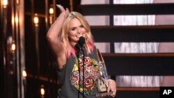 Miranda Lambert accepts the award for female vocalist of the year at the 49th annual CMA Awards at the Bridgestone Arena on Wednesday, Nov. 4, 2015, in Nashville, Tenn. (Photo by Chris Pizzello/Invision/AP)