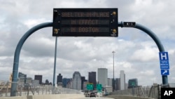 A sign calling for citizens of Boston to "Shelter in Place" is shown on I-93 in Boston on April 19, 2013.
