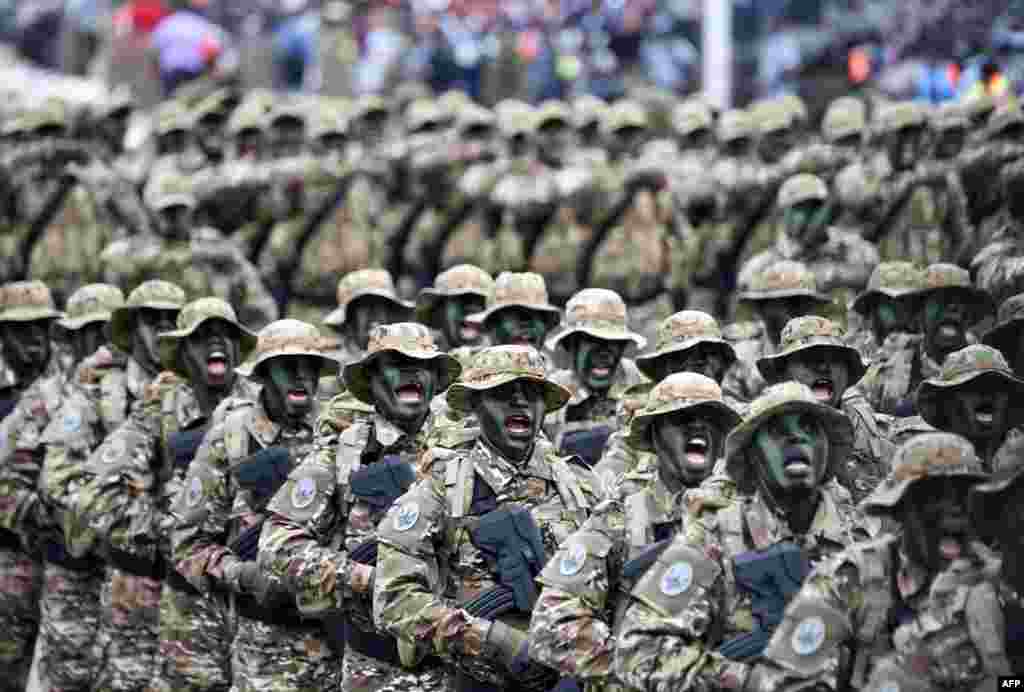 Soldiers of the Ivorian Special Forces parade during celebrations marking the 58th anniversary of Ivory Coast's independence from France.