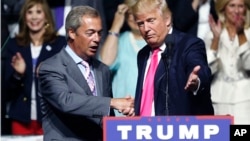 FILE - Then Republican presidential candidate Donald Trump welcomes Nigel Farage (L), leader of the British UKIP party, at a campaign rally in Jackson, Missouri, Aug. 24, 2016.