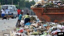 Children sift through garbage at a dumpsite in Harare, Zimbabwe.