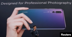 FILE - Richard Yu, CEO of the Huawei Consumer Business Group, attends the launching of the new generation of its smartphone, Huawei P20, in Paris, France, March 27, 2018.