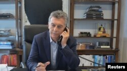 Argentina's President Mauricio Macri speaks by phone with U.S. President Donald Trump, in Buenos Aires, Argentina, Feb. 15, 2017. 