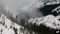 Fog and mist shroud the Sierra Nevada near Echo Summit, Calif., Feb. 2, 2017. Three January blizzards left snowpack 173 percent above average in the mountains.