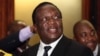 FILE: Zimbabwean Deputy President Emmerson Mnangagwa smiles at the headquarters of ZANU (PF) in Harare, Dec.10, 2014. 