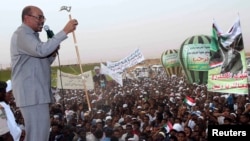 President Omar Hassan al-Bashir addresses a crowd in North Khartoum, June 8, 2013. 