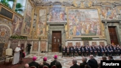 Pope Francis (L) makes his “State of the World” address during an audience with the diplomatic corps at the Vatican, Jan. 13, 2014.