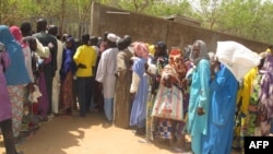 FILE- Cameroonian internally displaced queue for food aid at a camp in the extreme north of Cameroon, Feb. 22, 2017. Boko Haram attacks since August 2020 have displaced at least 7,000 people, Cameroon authorities say.