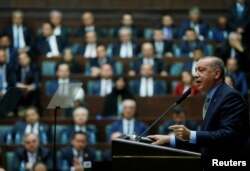 Turkish President Tayyip Erdogan addresses members of parliament from his ruling AK Party (AKP) during a meeting at the Turkish parliament in Ankara, Oct. 23, 2018. (Presidential Press Office via Reuters)