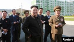 FILE - North Korean leader Kim Jong Un gives field guidance at the newly built Wisong Scientists Residential District in this undated photo released by North Korea's Korean Central News Agency (KCNA) in Pyongyang.