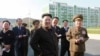 North Korean leader Kim Jong Un gives field guidance at the newly built Wisong Scientists Residential District in this undated photo released by North Korea's Korean Central News Agency (KCNA) in Pyongyang October 14, 2014. Kim, shown using a cane for sup