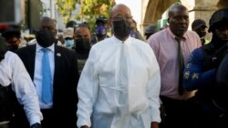 Haitian Prime Minister Ariel Henry tours the Justinien University Hospital, visiting burn victims of a gasoline truck that overturned and exploded in Cap-Haitien, Haiti, Dec. 14, 2021.