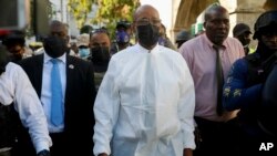 Haitian Prime Minister Ariel Henry tours the Justinien University Hospital, visiting burn victims of a gasoline truck that overturned and exploded in Cap-Haitien, Dec. 14, 2021. 