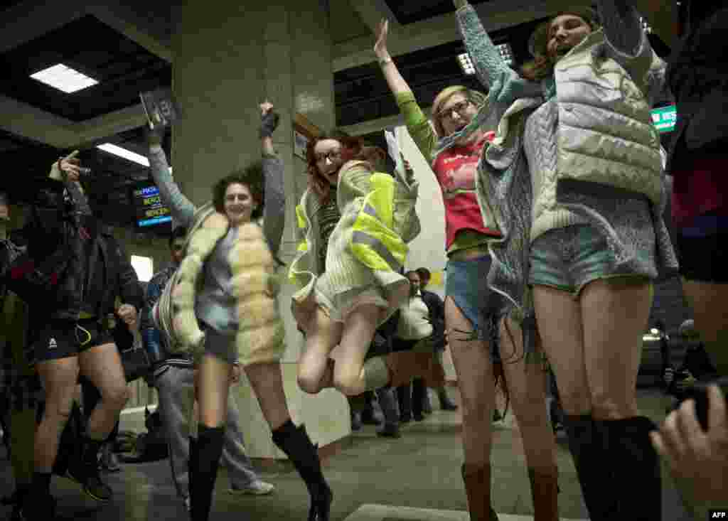 Young people, stripped to their underpants, jump in the air while waiting for the subway as they take part in Romania&#39;s first edition of the &quot;No pants subway ride day&quot; in Bucharest.