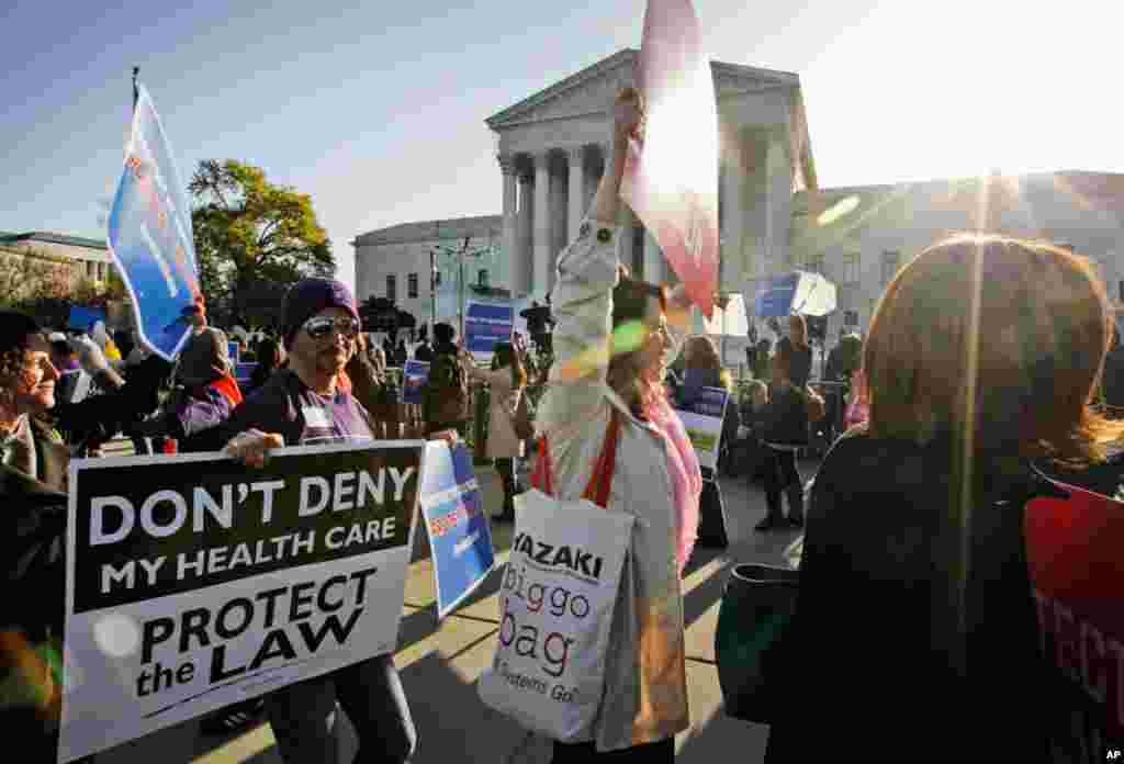 Supporters of health care reform rally in front of the Supreme Court March 27, 2012, as the court continued hearing arguments on the health care law signed by President Barack Obama. (AP)