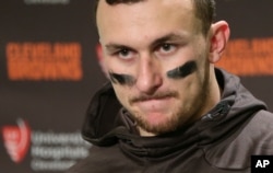 FILE - Cleveland Browns quarterback Johnny Manziel speaks with reporters.