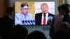 People watch a TV screen showing file footage of U.S. President Donald Trump, right, and North Korean leader Kim Jong Un during a news program at the Seoul Railway Station in Seoul, South Korea, April 21, 2018. 