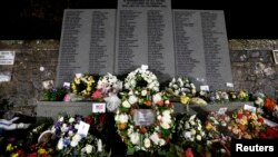 Wreaths at a memorial event on the 25th anniversary of the bombing of Pan Am flight 103, in the Dryfesdale Cemetery, Lockerbie, Scotland, Dec. 21, 2013.