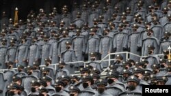U.S. Army cadets wearing protective masks stand at Michie Stadium ahead of the annual Army-Navy collegiate football game, in West Point, New York, U.S., December 12, 2020.