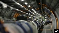 FILE - View of the Large Hadron Collider (LHC) in its tunnel at CERN (European particle physics laboratory) near Geneva, Switzerland.